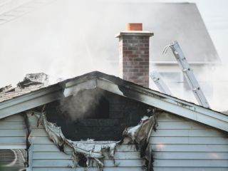 Fire cleanup process in progress at a Los Angeles residential property.